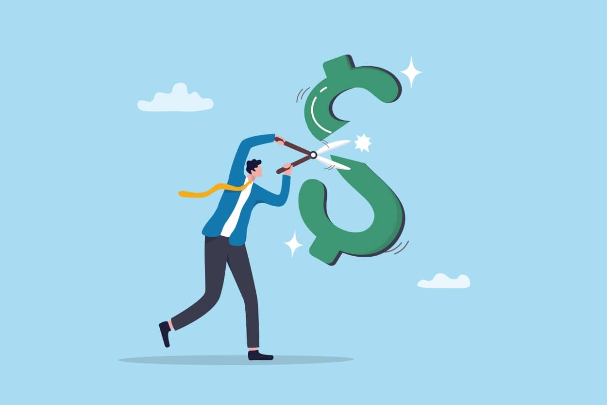 Man cutting estate tax in half with scissors